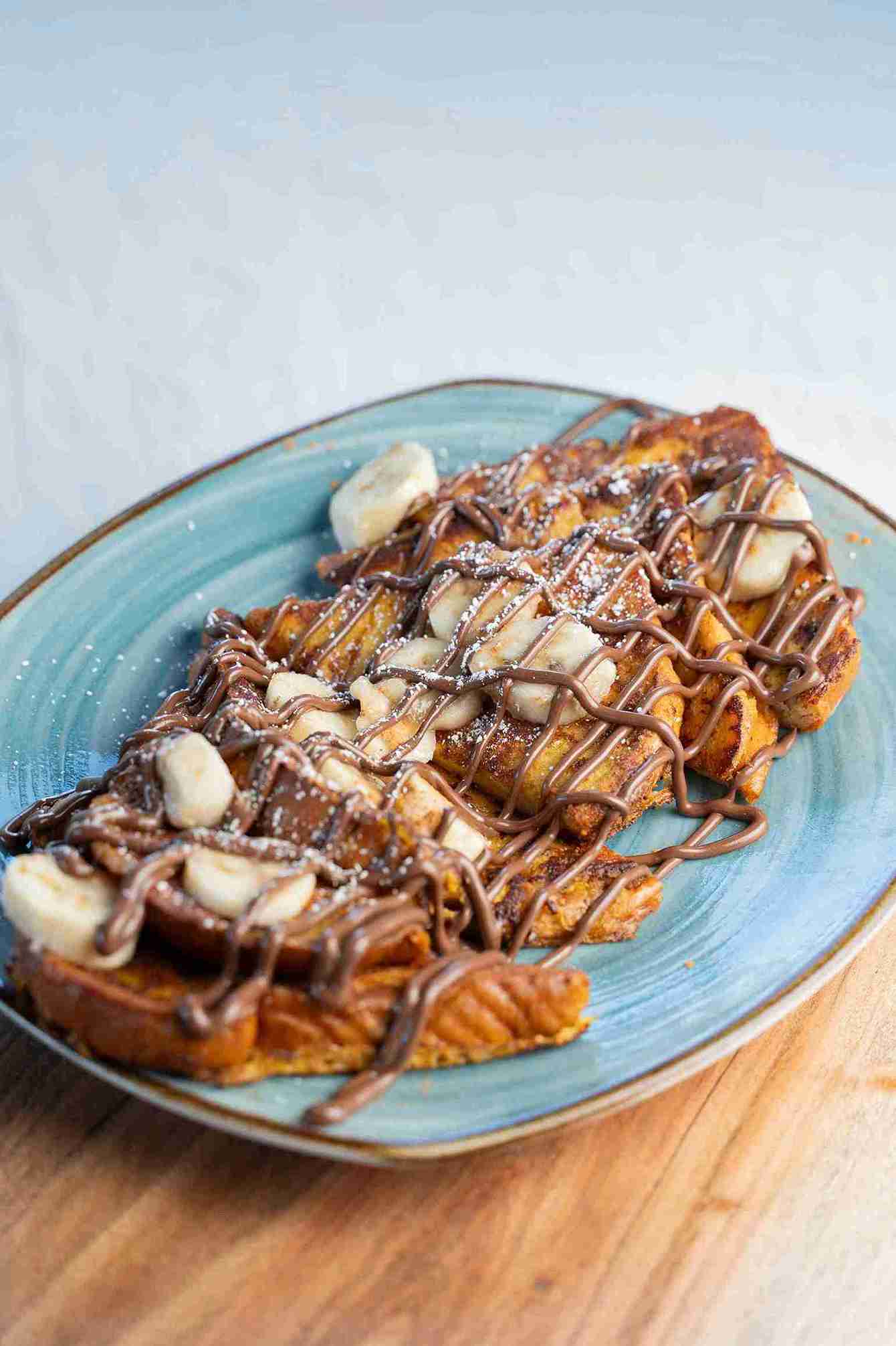 Nutella and banana stuffed French toast with powdered sugar